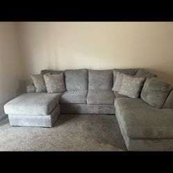 Gray Sectional With Defective Cushion 