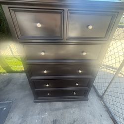 Tall dark brown dresser