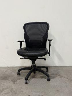 Black Leather office chair on wheels