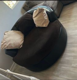 Big brown, brown, spinning loveseat