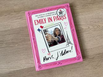 $20 for (1) Emily in Paris Hardcover Book - Pink & White Cover