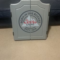 Coors light dartboard with darts and scoreboard