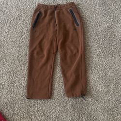 brown nike tech pants 