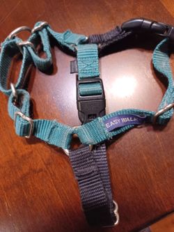 Dog harness make : "Easy Walk". Don't know size. med. perhaps. $5.