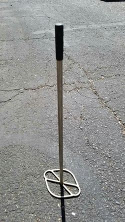 Stainless steel smasher or mixer.