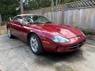 1999 Jaguar XK8 2 Door Convertible V-8 Deep Red/ tan top/ cream interior