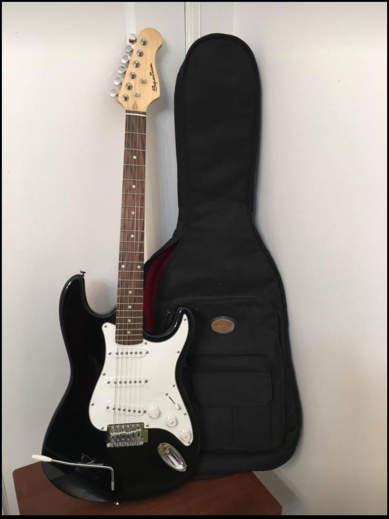 Spectrum Electric Guitar with black case and shoulder strap