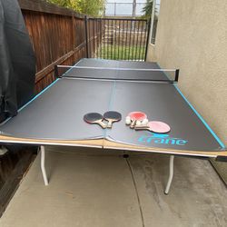wood table tennis with rackets, balls and cover