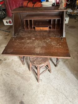 Old desk or mail desk.  Comes with old stool