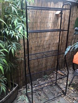 Black metal shelf about 6 feet tall  great for home storage or plants asking $40 obo