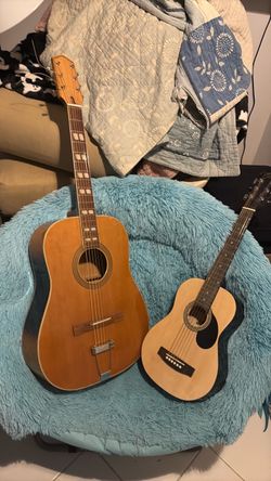 2  acoustic guitars. One for children  and one for adults