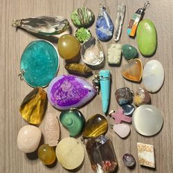 Pretty stones, pendants and trinkets. All different colors and sizes. As is. No returns. Make me an offer I can’t refuse. Please feel free to ask any 
