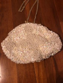 Small pocketbook with gold strap chained