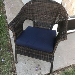 Wicker patio chair with cushion