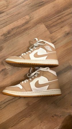 Tan and white jordan’s