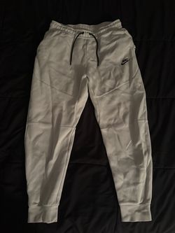 White Nike tech pants