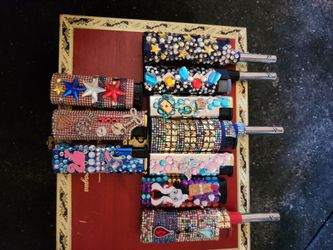 Hand decorated torches for sale.