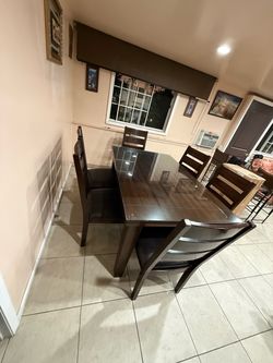 Wood table with 6 chairs and glass protector used ,like new