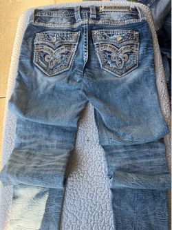 Rock Revival Women’s Jeans with embellished pockets Size 26