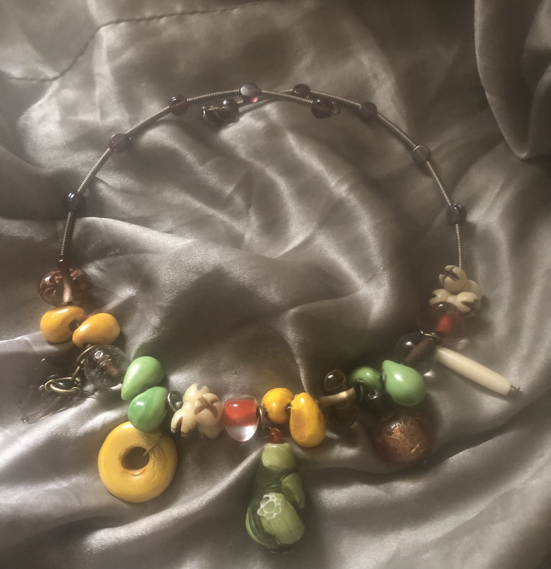 Necklace Adorned With Exceptionally Unique Items On Silver Band
