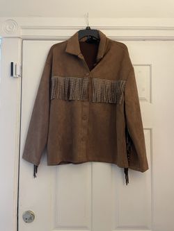 Like new adorable and unique light brown fringe jacket. Worn once. Womens size medium