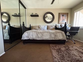 Solid dark wood twin trundle bed.