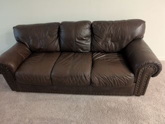 Brown leather sofa and loveseat