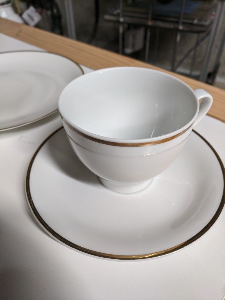 Set Of White China With A Gold Rim