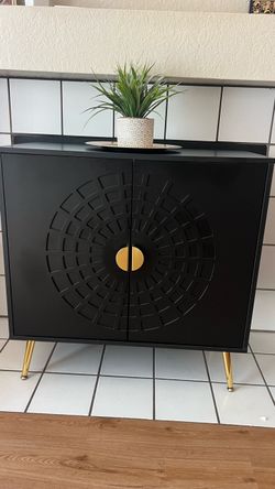 Black Cabinet with Gold Legs and Hardware