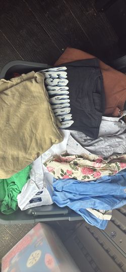 Boys clothing bin full of shirts