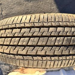 Single (1) 215 70 15 Firestone Champion Fuel Fighter All season tire