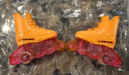 Vintage 1991 Mattel Barbie "Flicker n' Flash" orange and pink inline skates (rollerblades) made for 11-inch fashion dolls.