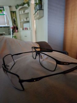 Two eye glasses  frames Oakley
