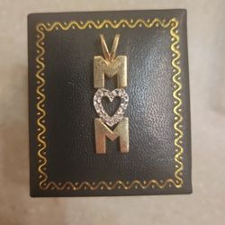 10 K Gold Mom Pendant With Diamonds. Weight Is 2.5 Grams
