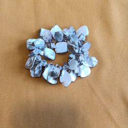 8 inch With Earthly Tone. Assorted Shapes of Charms spaced with Crystal Beads.