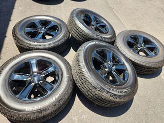 18" Jeep Wrangler black factory wheels and tires
