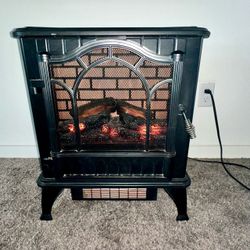 Electric heater with life like flame glowing log