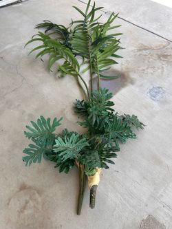 Unassembled artificial faux plant.