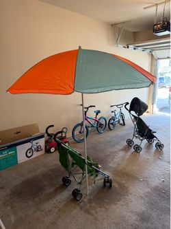 Beach umbrella with sand peg.