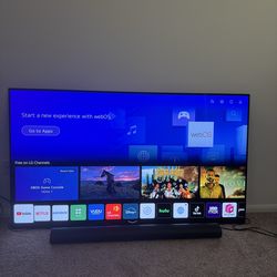 Modern light wood TV stand / media console in excellent condition. Very lightly used and still looks great. Clean design with black metal frame and 2 