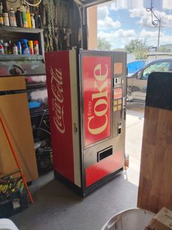 Coca-Cola vending machine works ice cold