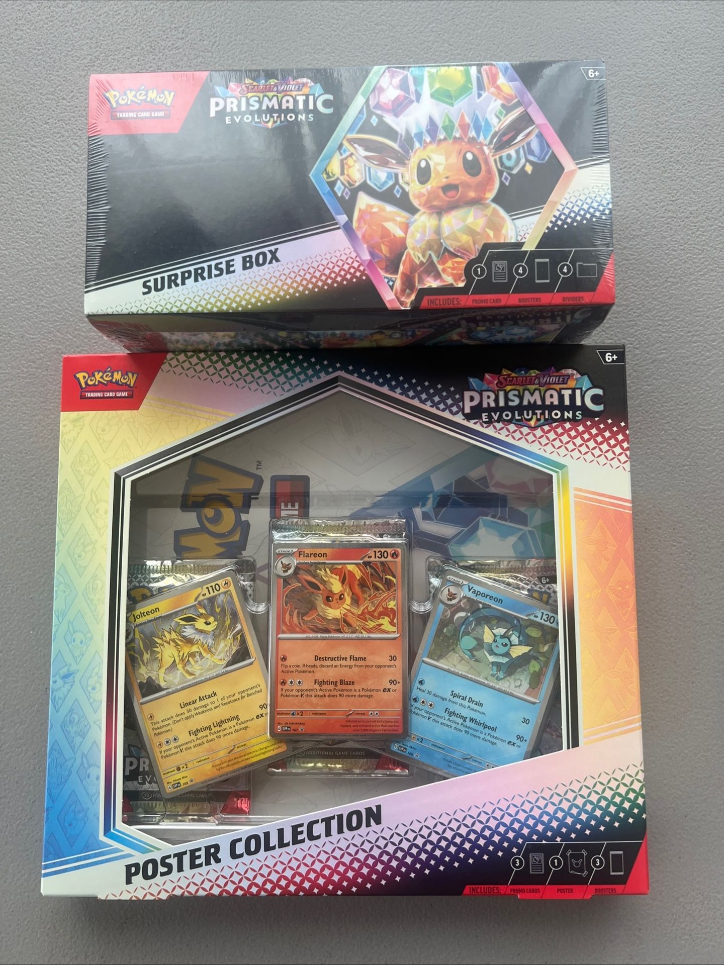 Sealed Pokemon Prismatic Evolutions Poster Collection and Surprise Box