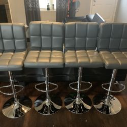 New Set Of 4 gray Bar Stools / Adjustable Height And Swivel / Price Is Firm / Pick Up Only / gray Pub Stools  new in  box 