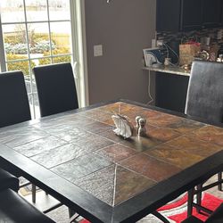 African Slate Dining Table with 8 Black Upholstered Dining Chairs