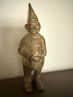 vintage cast metal coin bank, a gnome / elf / pixie bank,