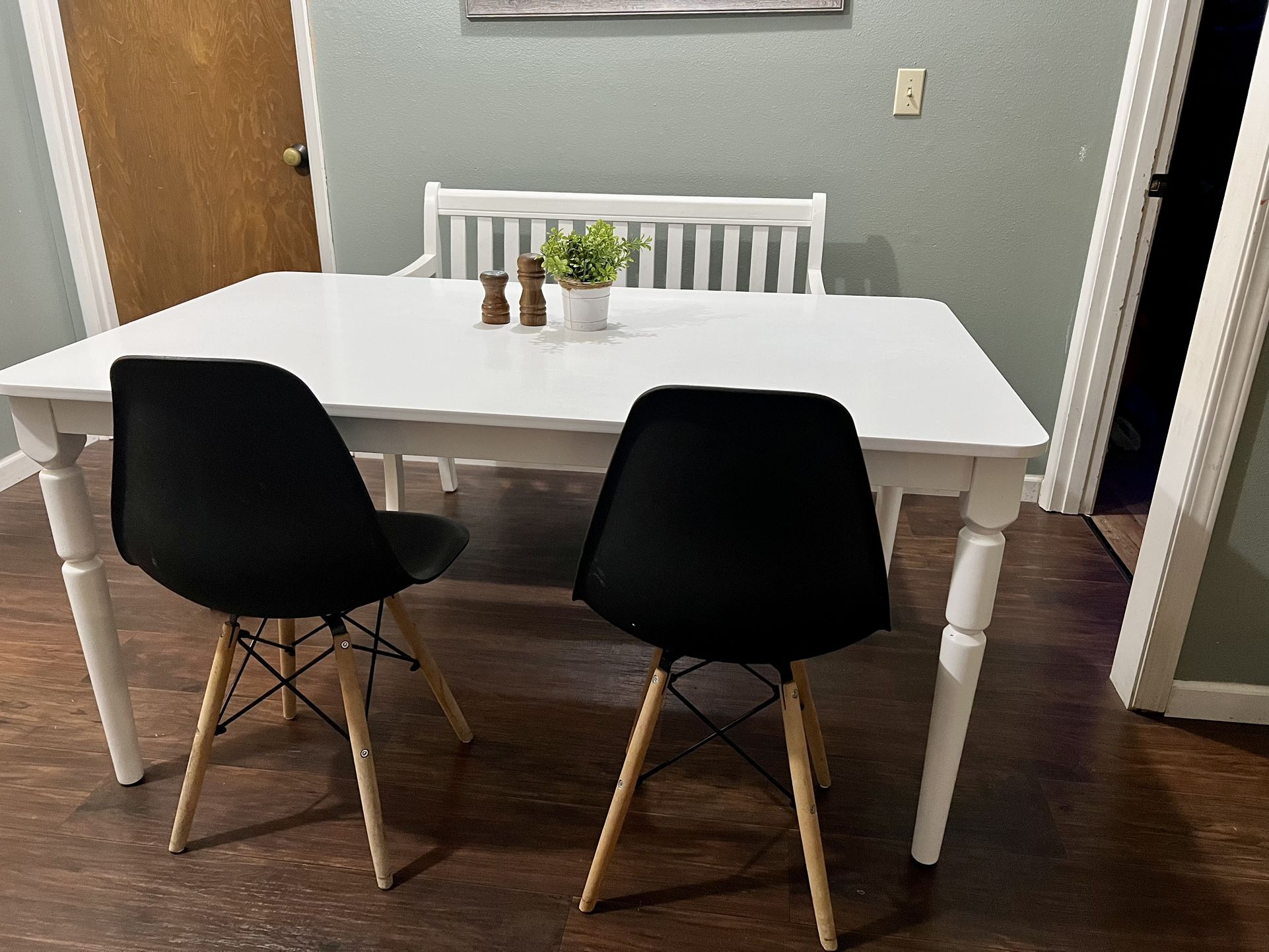 Modern Wooden Table With Storage Bench And Eames Style Chairs