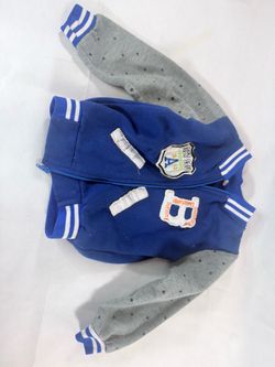 Blue and gray kids jacket with white stripes on sleeves and collar, and a white number 8 patch on the chest #kidsfashion #sporty