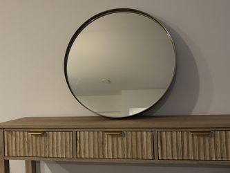 Gold round mirror