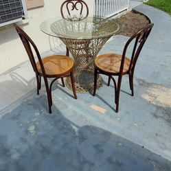 round table with 3 chairs 36x30 the brand of the chairs is Bentwood Thonet Cane Chair 