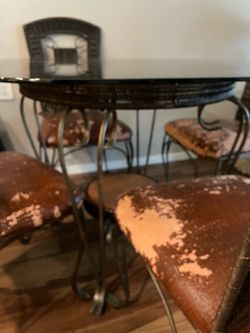 Table and 4 leather chairs